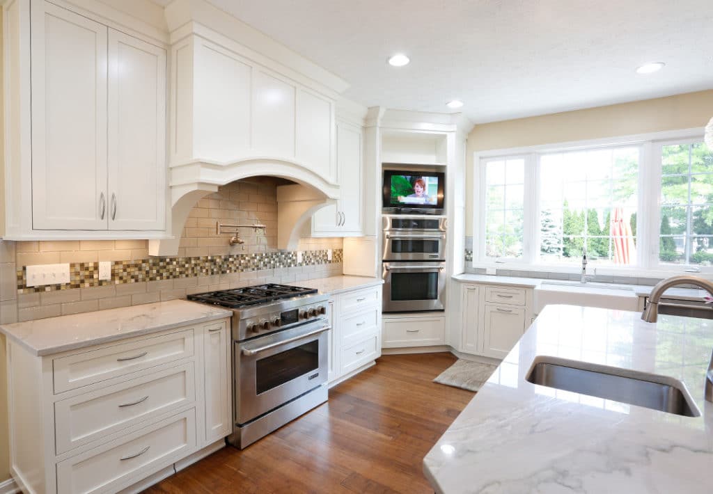 Double Ovens with TV in Custom Kitchen