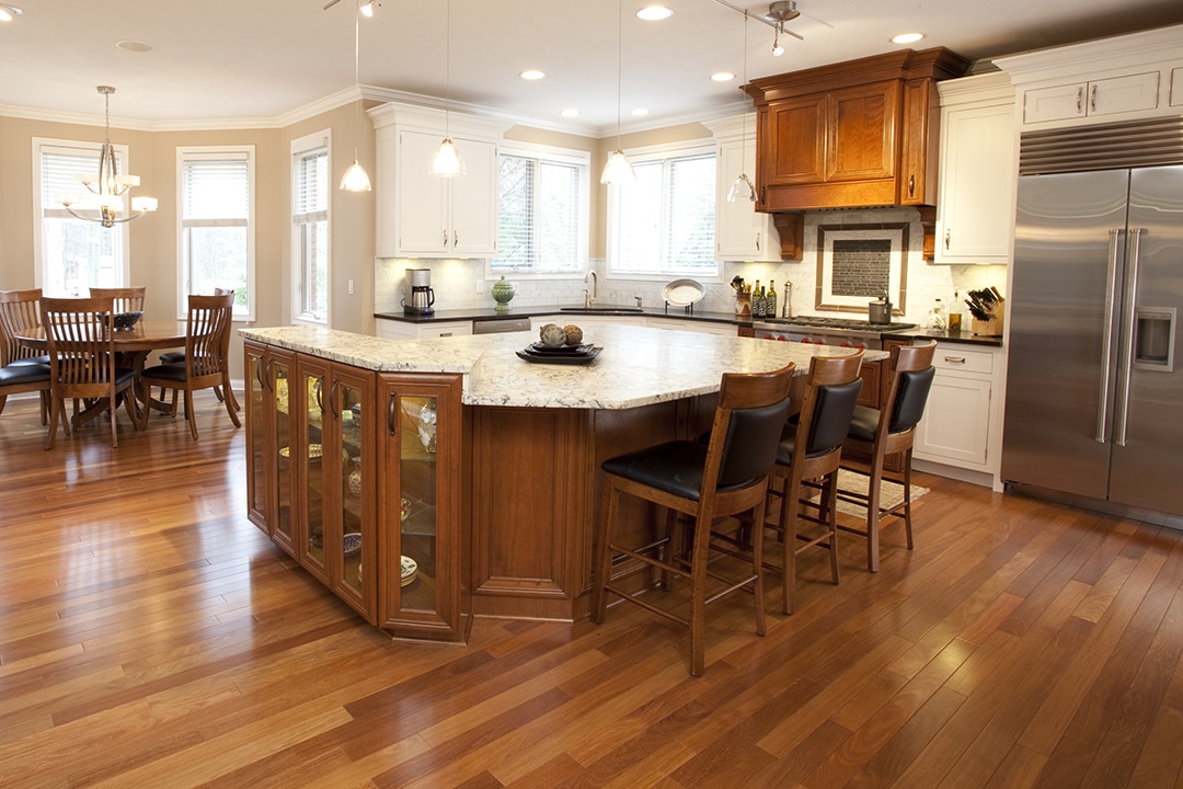 Remodeled kitchen with hardwood floor and coordinating island