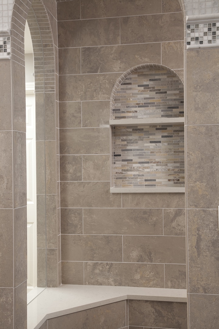 Shower room with wall, floor and accent tiles in coordinating color palette