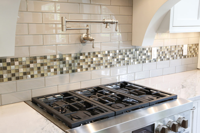 Kitchen backsplash with subway tile and mosaic accent tile