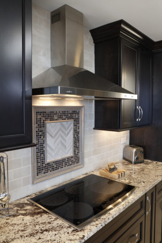 Focal point tile inlay above cooktop