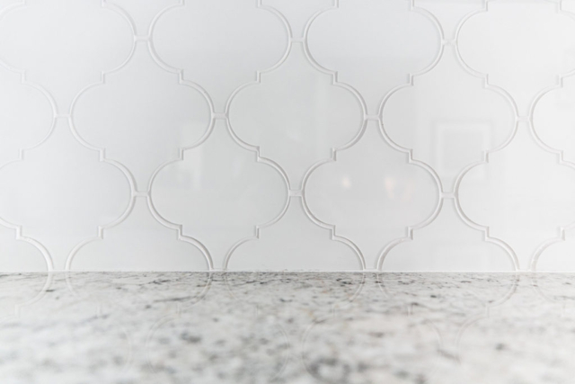 Unique shaped glass tile used for kitchen backsplash
