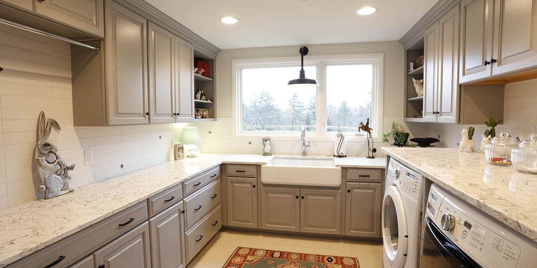 Laundry room with storage and farmhouse sink