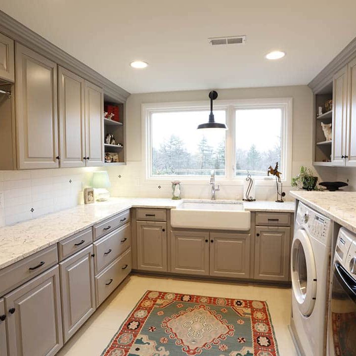 Laundry room with storage and farmhouse sink