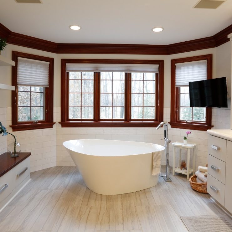 freestanding tub with tile flooring