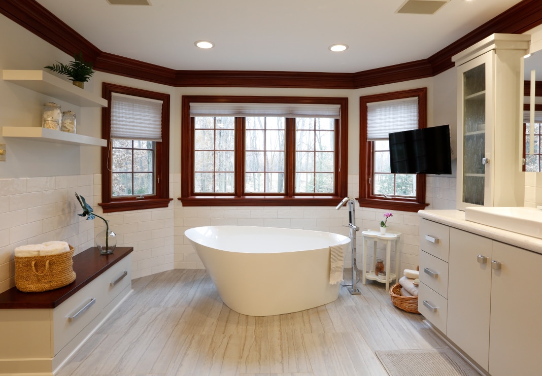 freestanding tub with tile flooring
