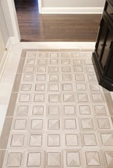 Natural stone inlaid tile used in entryway  