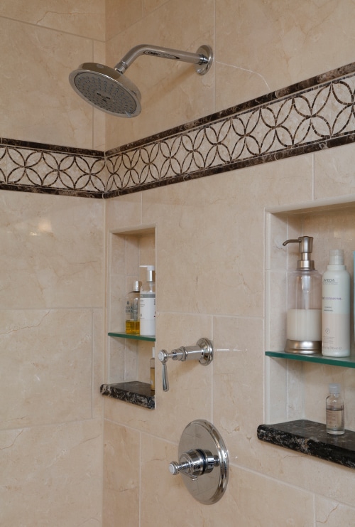 Decorative accent tile lines wall in custom shower 
