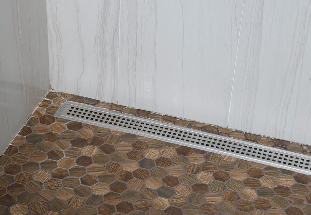 Sleek Linear Drain with Hexagon Mosaic Tile