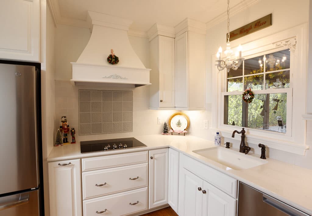 Kitchen Sink with Mini Chandelier and Gorgeous Vent Hood