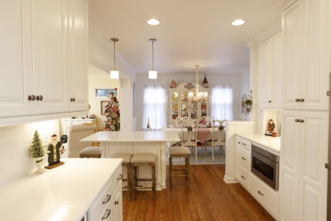 Charming white kitchen with storage and island seating