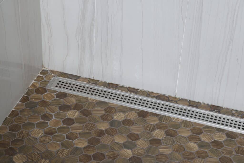 floor tile with integrated shower drain